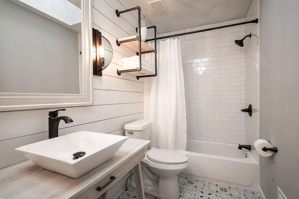 Tiled walk-in shower with glass enclosure